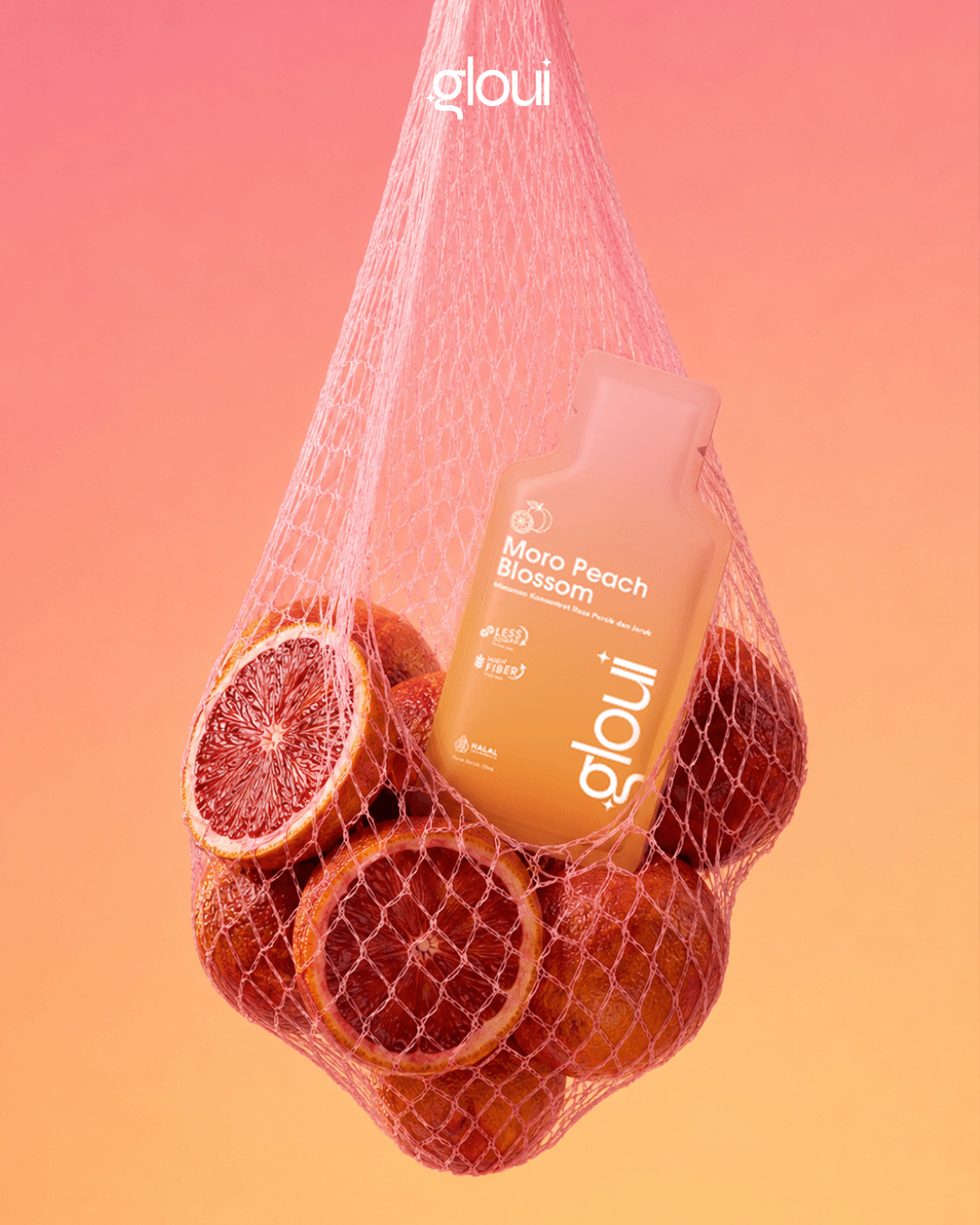 Gloui sachet in a mesh bag with fresh Moro blood oranges