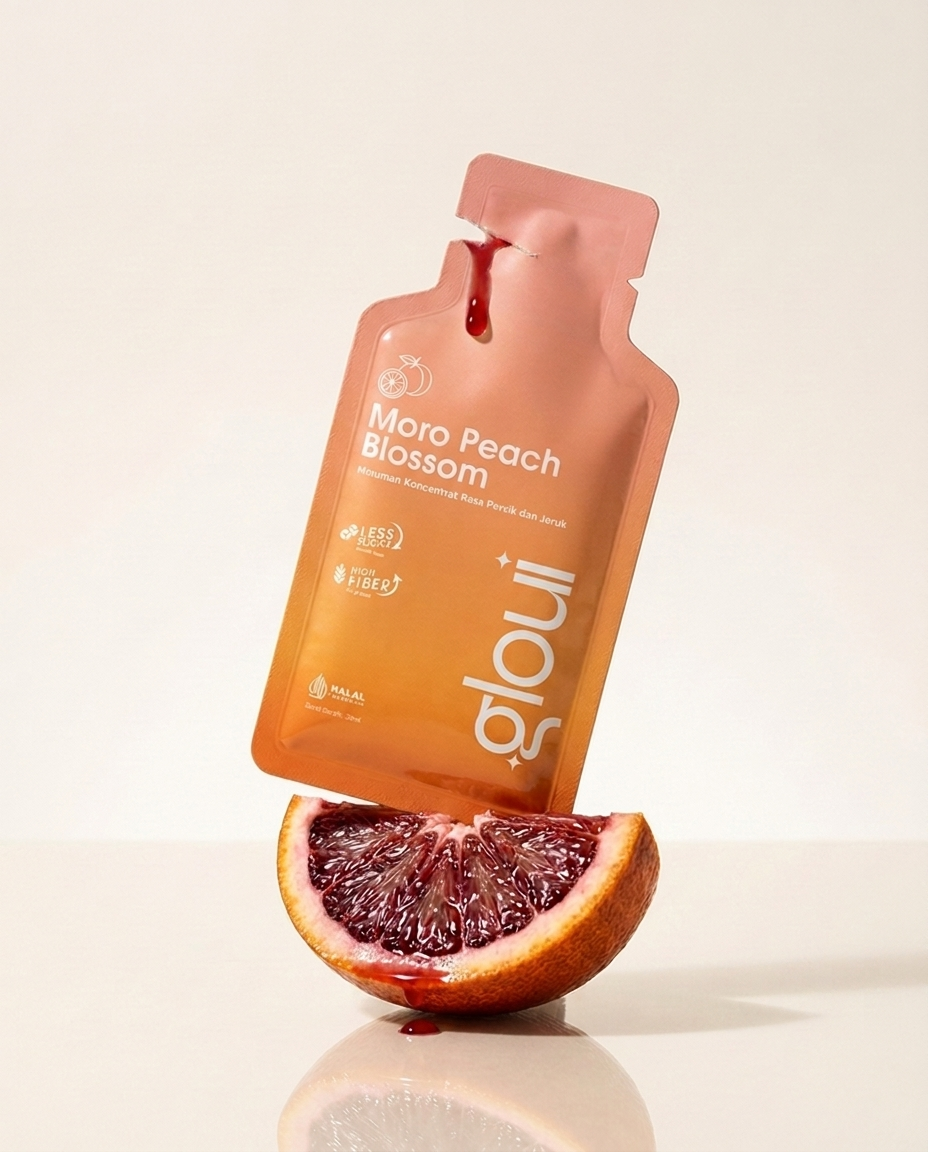 Gloui Moro Peach Blossom sachet above a fresh blood orange wedge